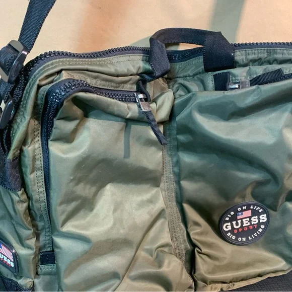Guess Green Messenger Bag with Adjustable Strap and zipper pockets